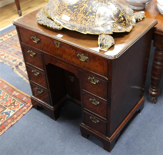 A kneehole desk, W.76cm